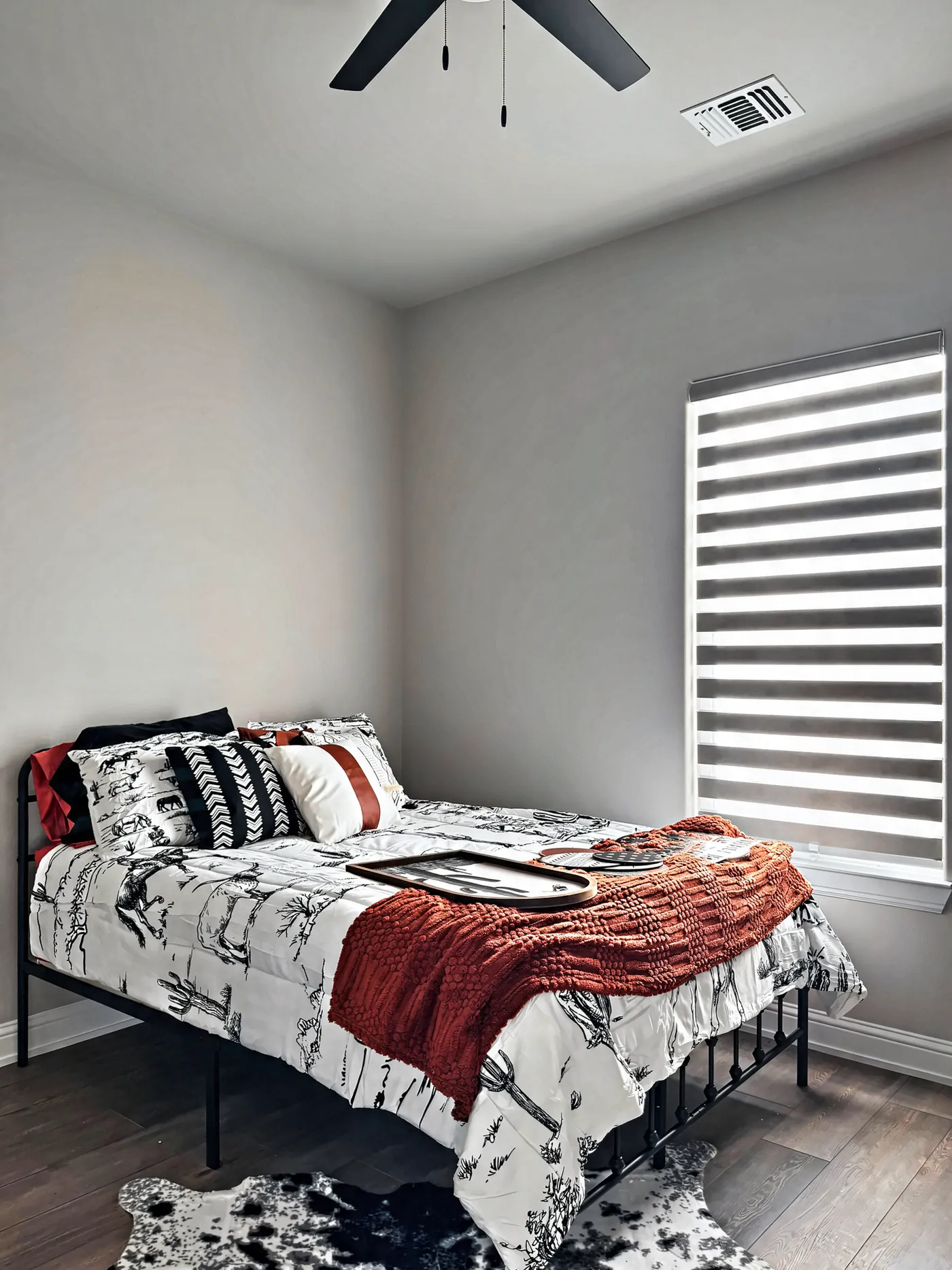 White zebra shade on a guest bedroom window
